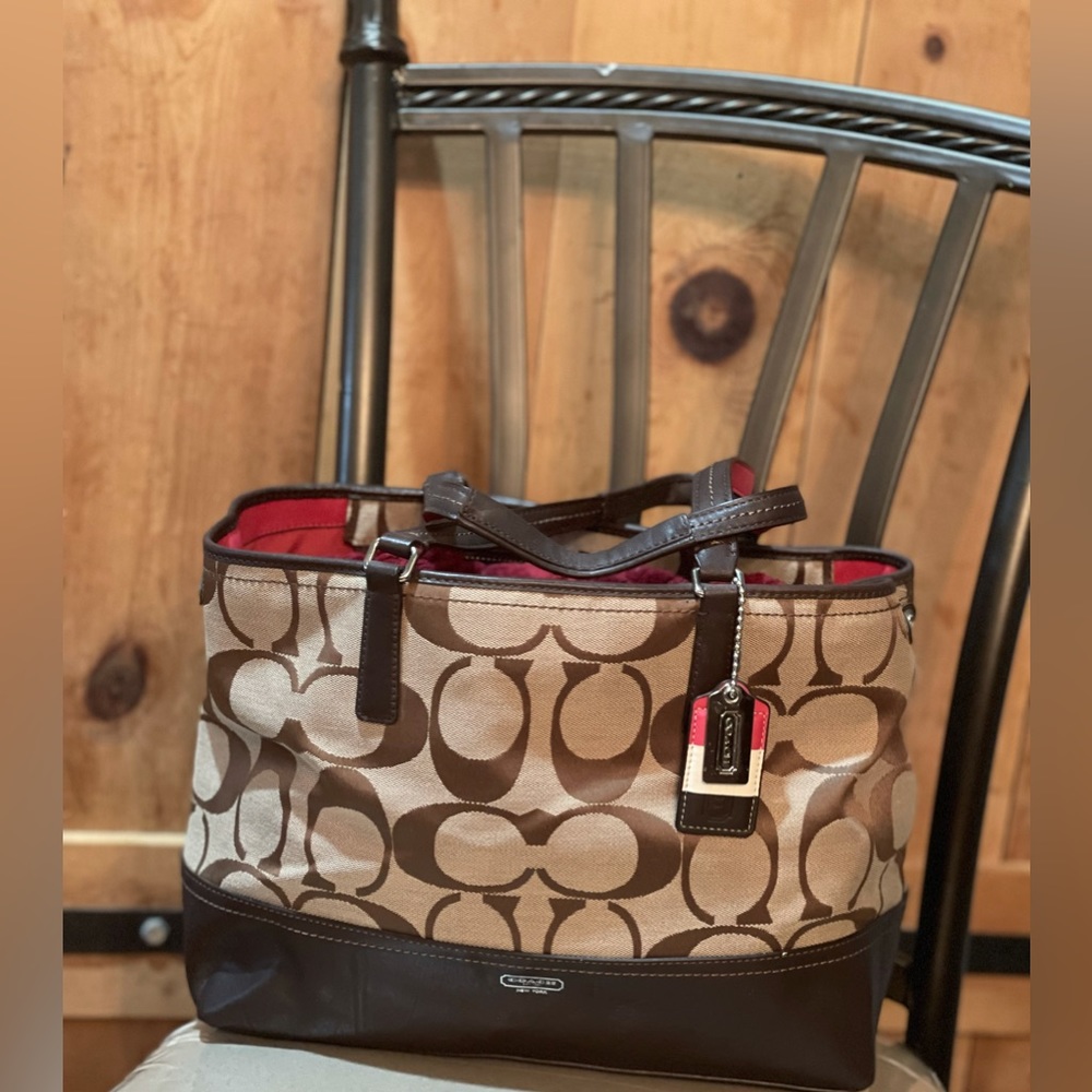 Coach Tote bag, signature style 17” L 10” H w/o handles, 18” H w/handles.